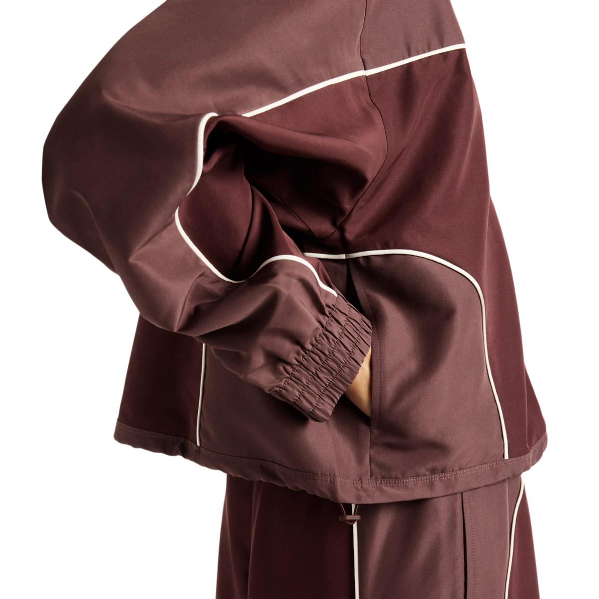 New Balance Trackside Woven Track Top Dame CHERRY LEATHER